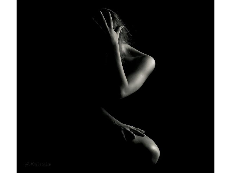 black and white image of silhouetted female body
